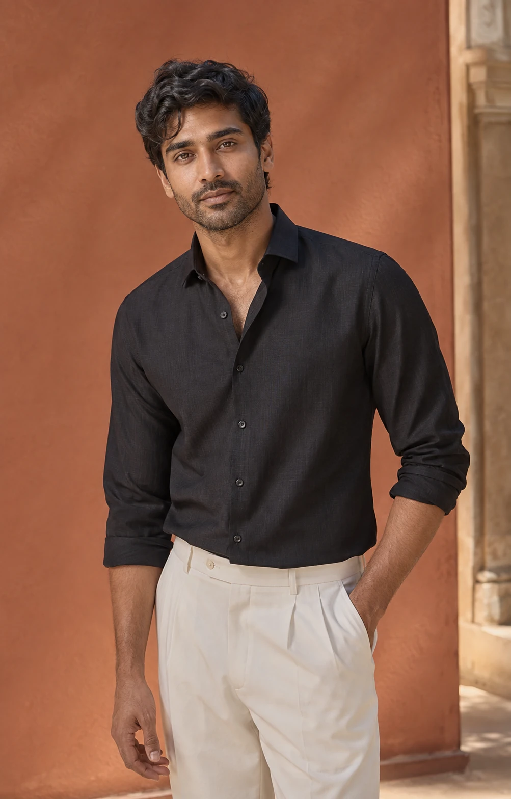 AI-generated Indian menswear portrait with a charcoal shirt and ivory tailored trousers